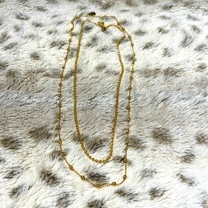 Two gold beaded chains (inner chain is a choker)